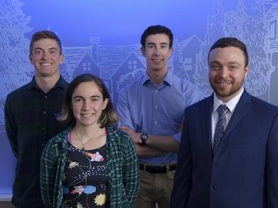four students who won goldwater scholarships posing in front of blue background
