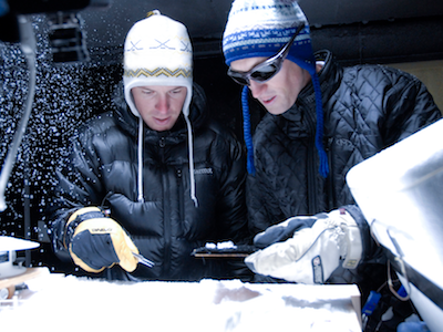 Two MSU students in Subzero Facility examining snow sample